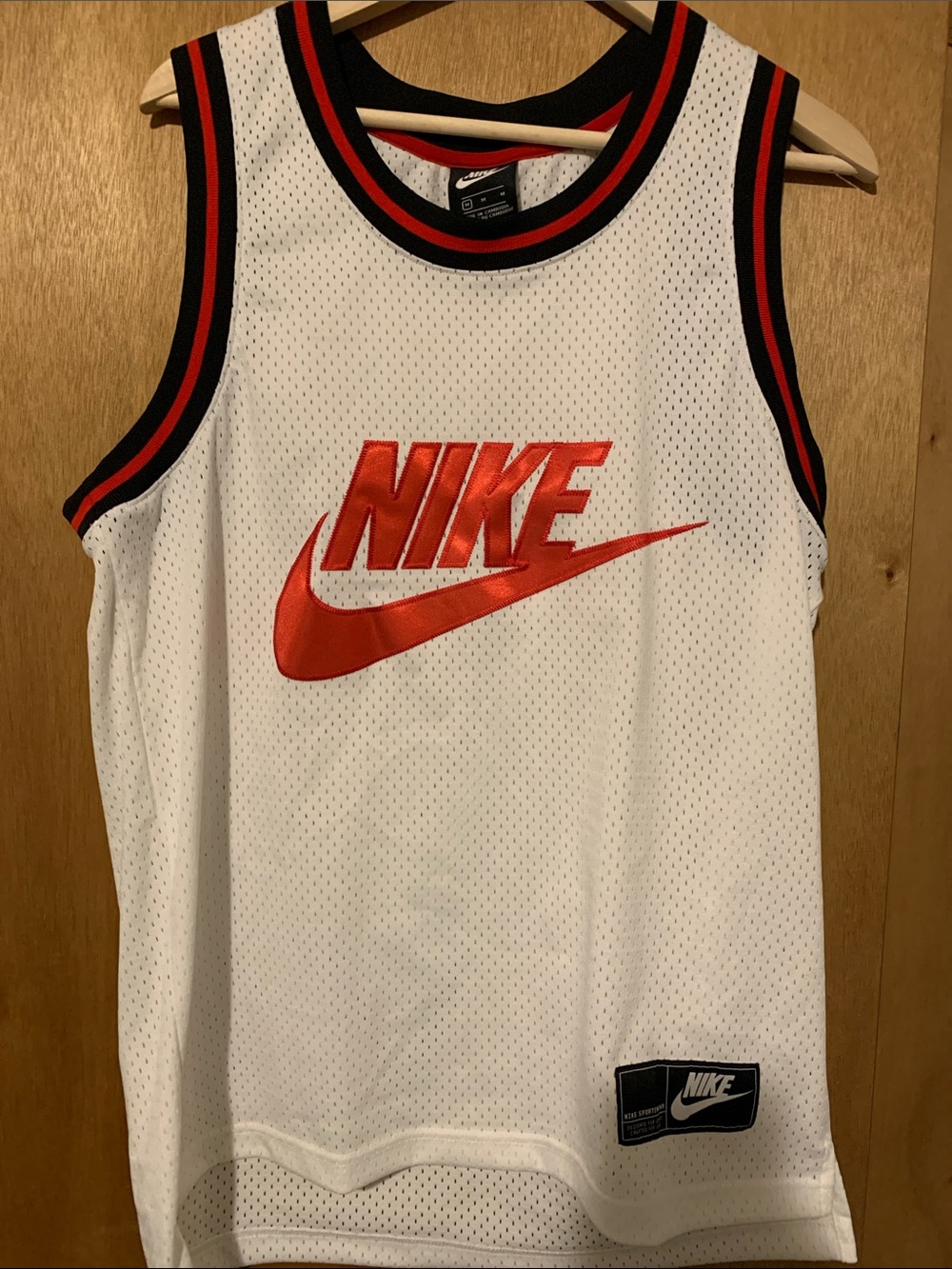 Unisex 

Nike White Mesh Basketball Tank with Red Logo and Black